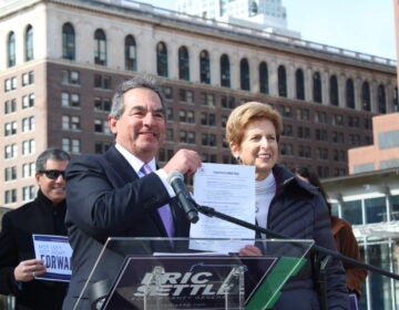 Eric Settle posing with Christine Todd Whitman