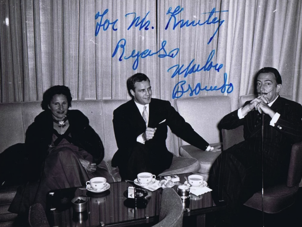 Old autographed photo featuring Marlon Brando and Salvador Dali