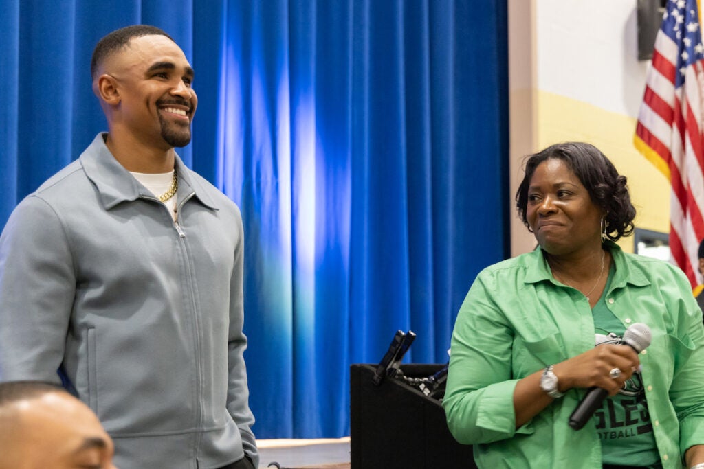 Eagles QB Jalen Hurts with Edward Gideon principal Shauneille Taylor