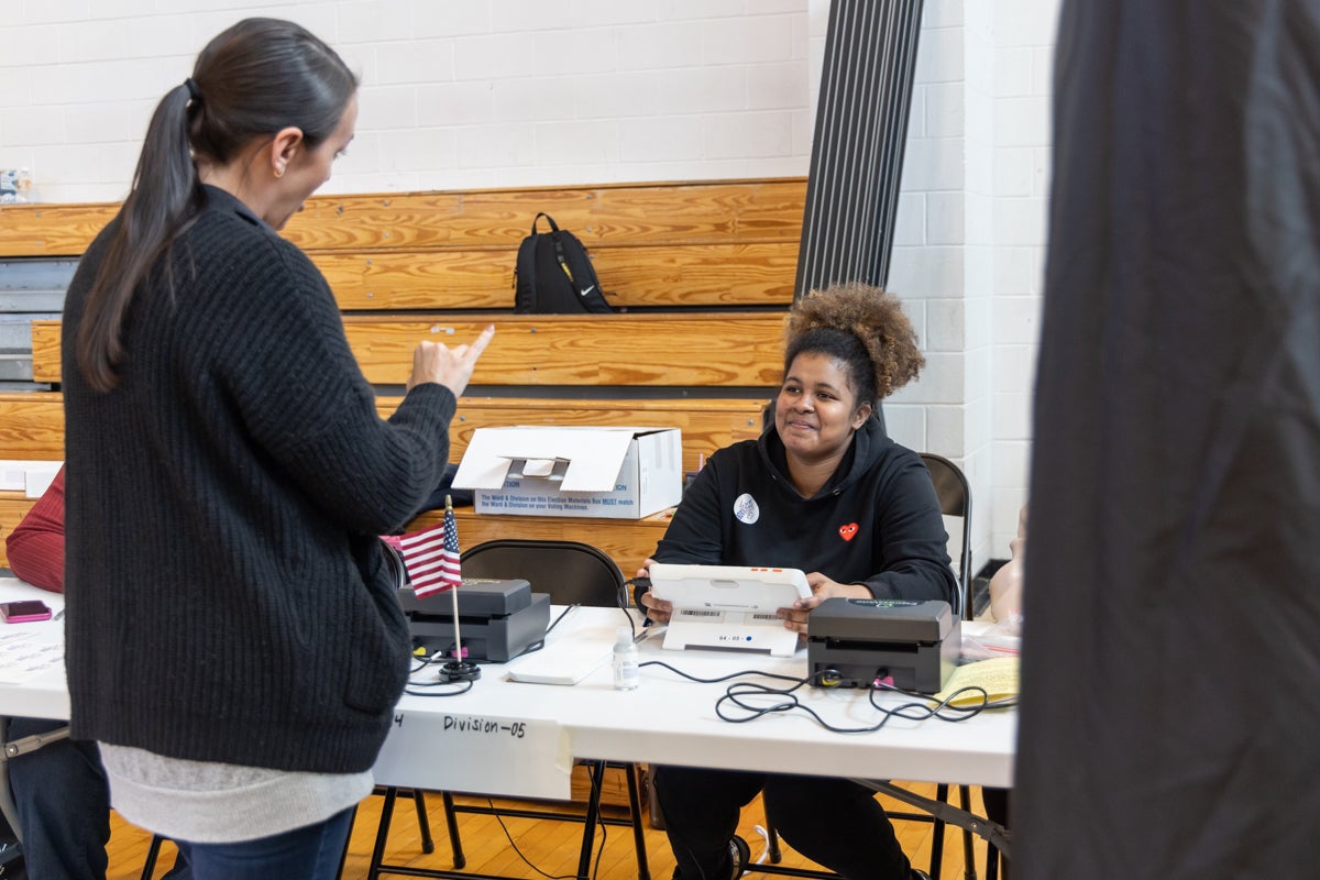 Didianna Victorino works at a polling station