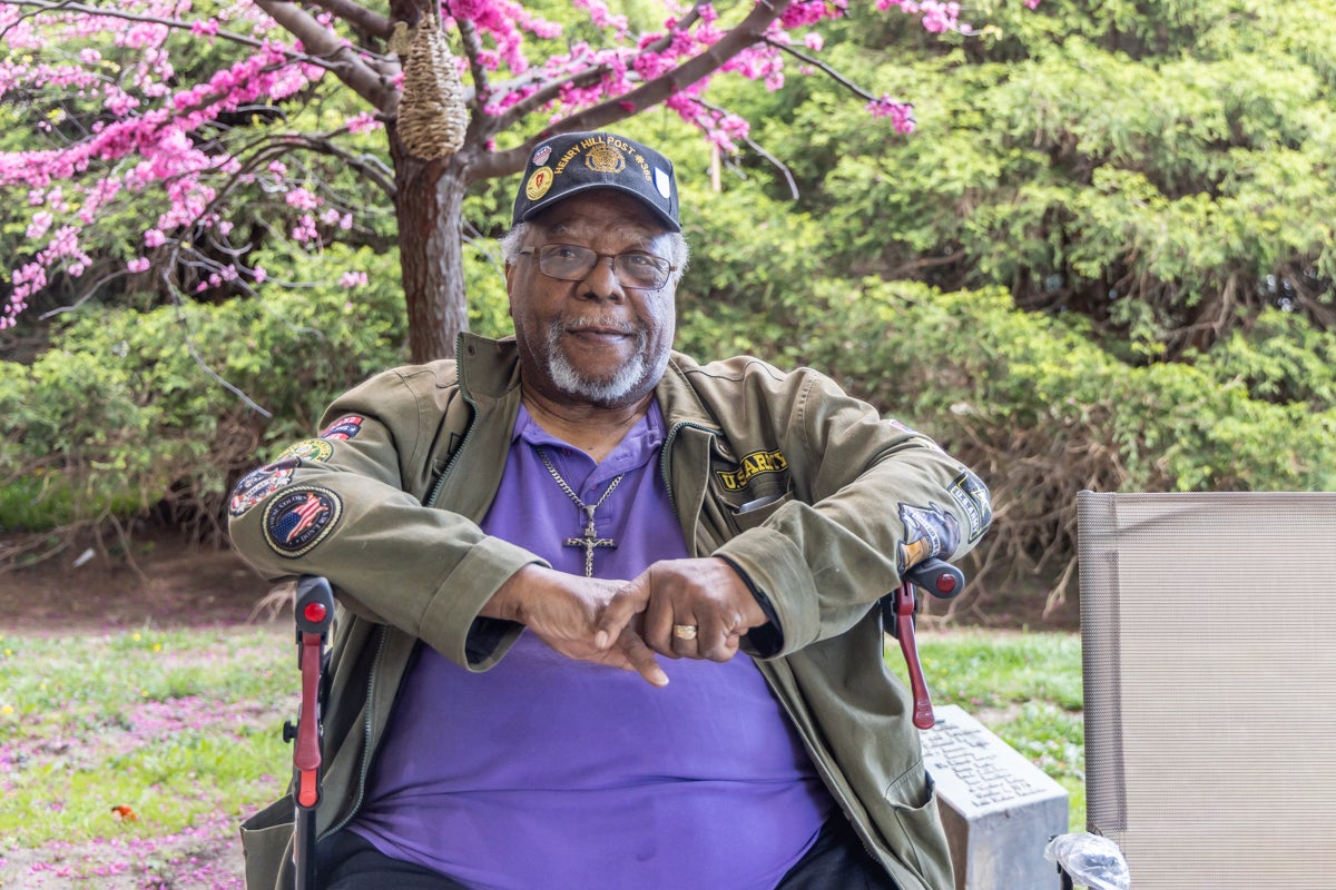 Stanley Elam sits outside