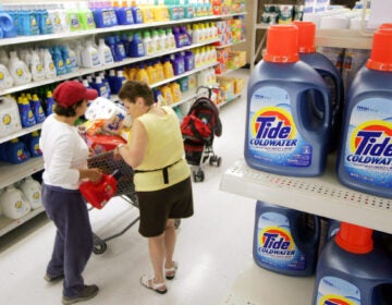 Shoppers pass a display of Procter & Gamble's Tide detergent at a Wal-Mart in White Plains, N.Y. July 21, 2006. (AP Photo/Mark Lennihan)