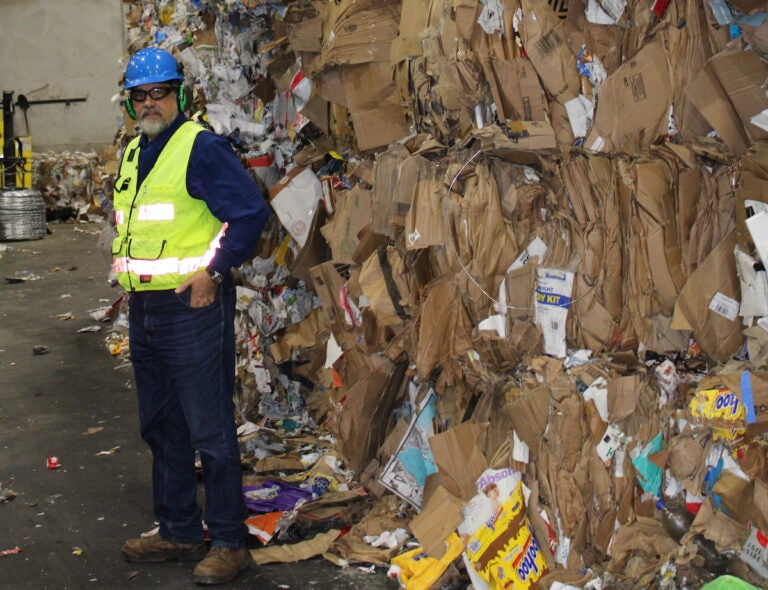 Environmental consultant Wayne DeFeo surveys the daily collection at the Robert C. Shinn, Jr. Recycling Center in Westampton, NJ. (Grant Hill/WHYY)
