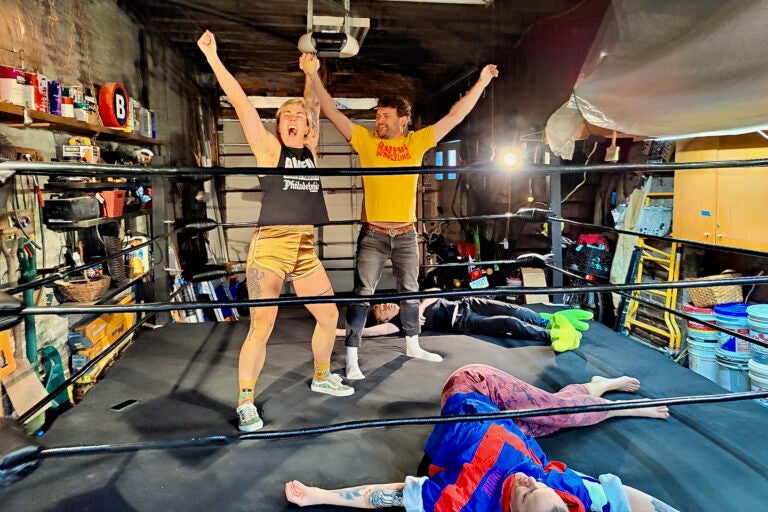 Jerry Kaba helps Jett Biggert choreograph their victory inside a practice ring before AWFUL Wrestling stages its MocaMania event. (Peter Crimmins/WHYY)