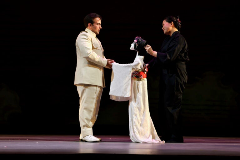 Karen Chia-ling Ho (right), manipulates the puppet representing Madame Butterfly during a love scene with Lt. Pinkerton (Anthony Ciaramitaro).