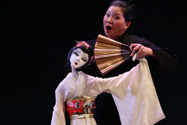 The title role of Madame Butterfly in Opera Philadelphia's production is represented by a puppet, voiced and manipulated by Karen Chia-ling Ho.