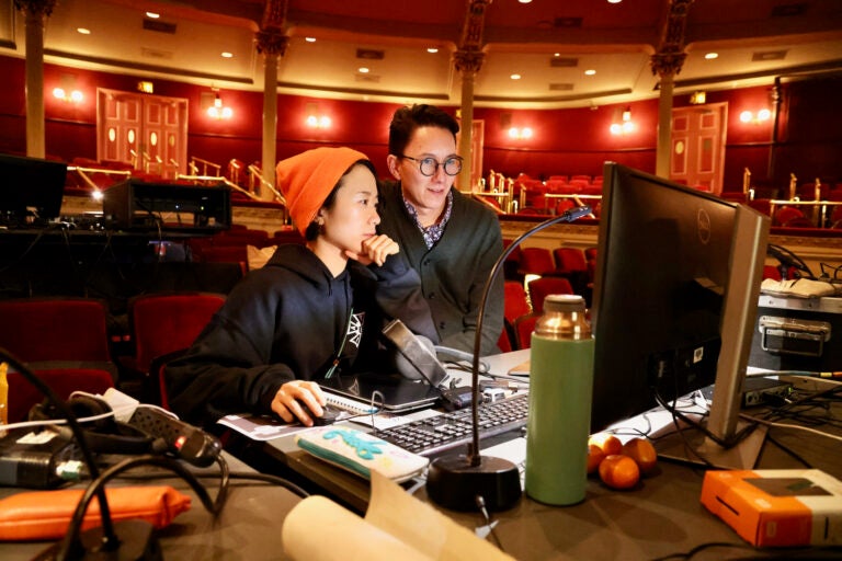 Production designer Yuki Izumihara (left) and director Ethan Heard prepare for a dress rehearsal of Madame Butterfly with Opera Philadelphia at the Academy of Music.