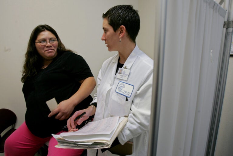 A family nurse practitioner talks with a pregnant patient at the Clinica de Salud del Valle de Salinas, a community clinic, in Salinas, Calif. (AP File Photo)