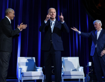 Joe Biden on stage with Barack Obama and Bill Clinton
