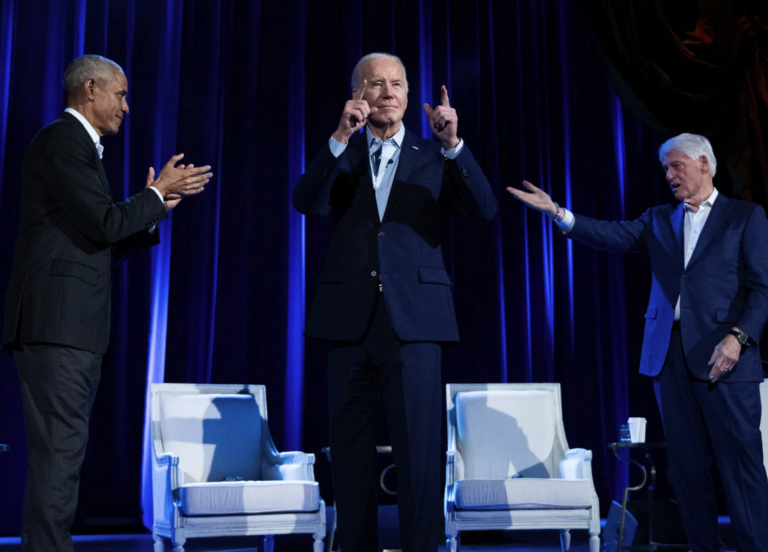 Joe Biden on stage with Barack Obama and Bill Clinton