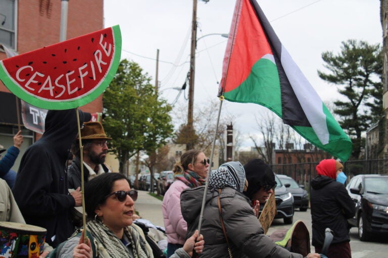 More than 100 people marched down Germantown Avenue from Lovett Memorial Library to the Johnson House Historic Site to demand a ceasefire in Gaza on April 6, 2024. (Emily Neil/WHYY)