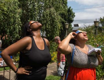People watching the eclipse with special protective glasses