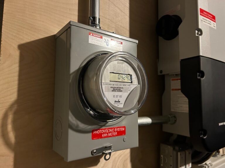 A meter shows energy produced by a photovoltaic system