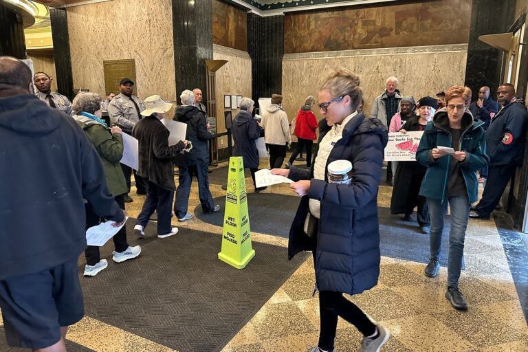 Peace activists protest in the lobby of the U.S. Custom House in Old City