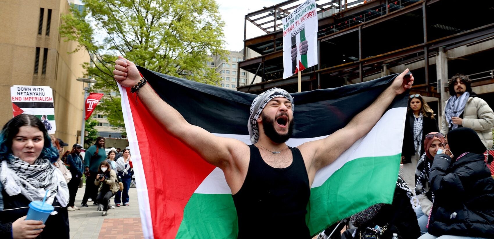 Community College of Philadelphia student from Palestine chants pro-Palestine slogan under the Bell Tower on Temple campus