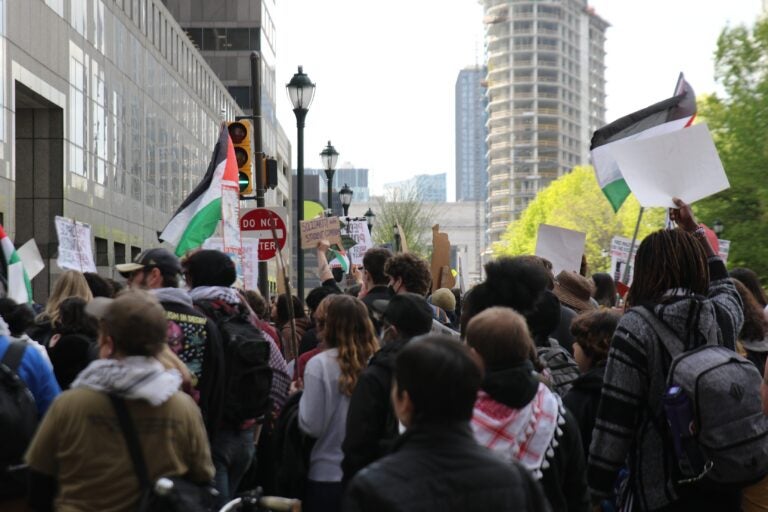 Protesters marched from City Hall down Market Street and met up with others from Drexel University. (Cory Sharber/WHYY)