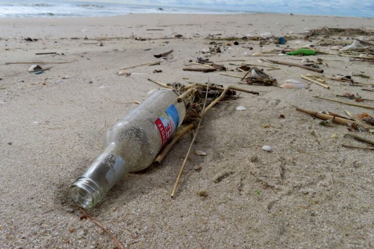 A bottle sits on the Jersey Shore