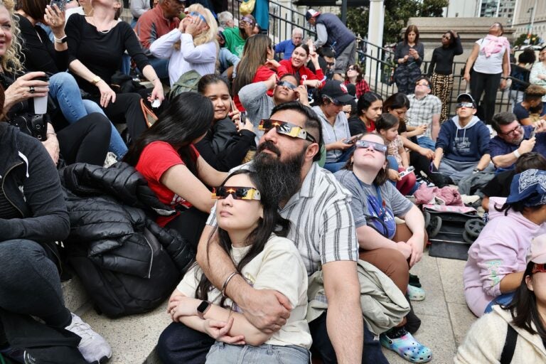 Eclipse viewers on the steps of the Franklin Institute