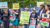 activists hold signs at FDR Park
