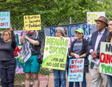 activists hold signs at FDR Park