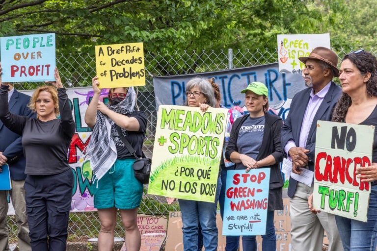 activists hold signs at FDR Park