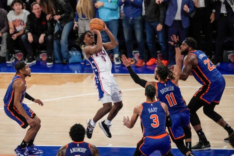 Philadelphia 76ers' Tyrese Maxey (0) shoots over New York Knicks' Jalen Brunson