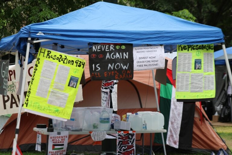 signs at the Penn encampment