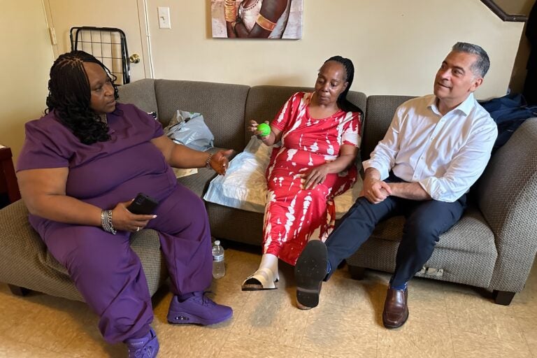Xavier Becerra, Katrina Francis and Lolita Owens sit on a couch