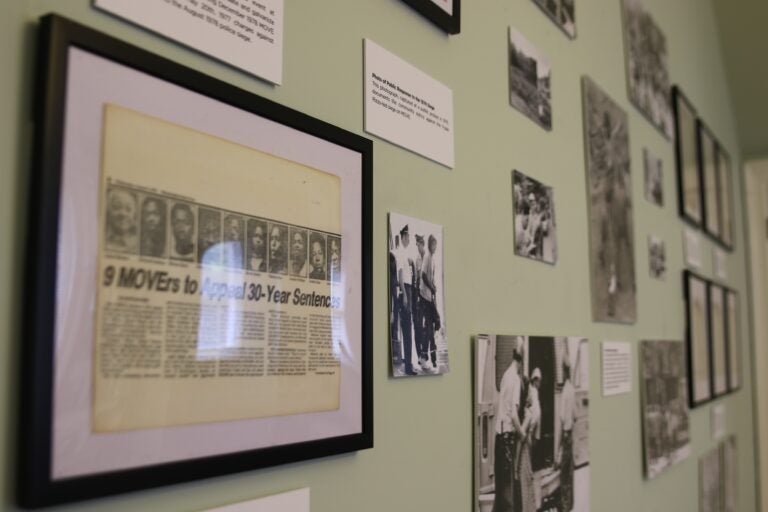 newspaper clippings and photos on the wall