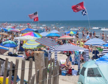 Beachgoers enjoy the sand and surf in North Wildwood N.J. on July 7, 2023. (AP Photo/Wayne Parry)