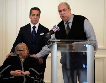 Sam Lemon, right, speaks during a news conference with Susie Williams Carter, center, and lawyer Michael Pomerantz, Monday, May 20, 2024, in Philadelphia. Carter is the sister of the youngest person ever executed in the state of Pennsylvania, Alexander McClay Williams, 16, and Lemon is the great-grandson of the attorney who represented him. Carter is suing the county where the Black teenager was convicted in 1931. The suit comes two years after Williams' conviction by an all-white jury was vacated. (AP Photo/Matt Slocum)