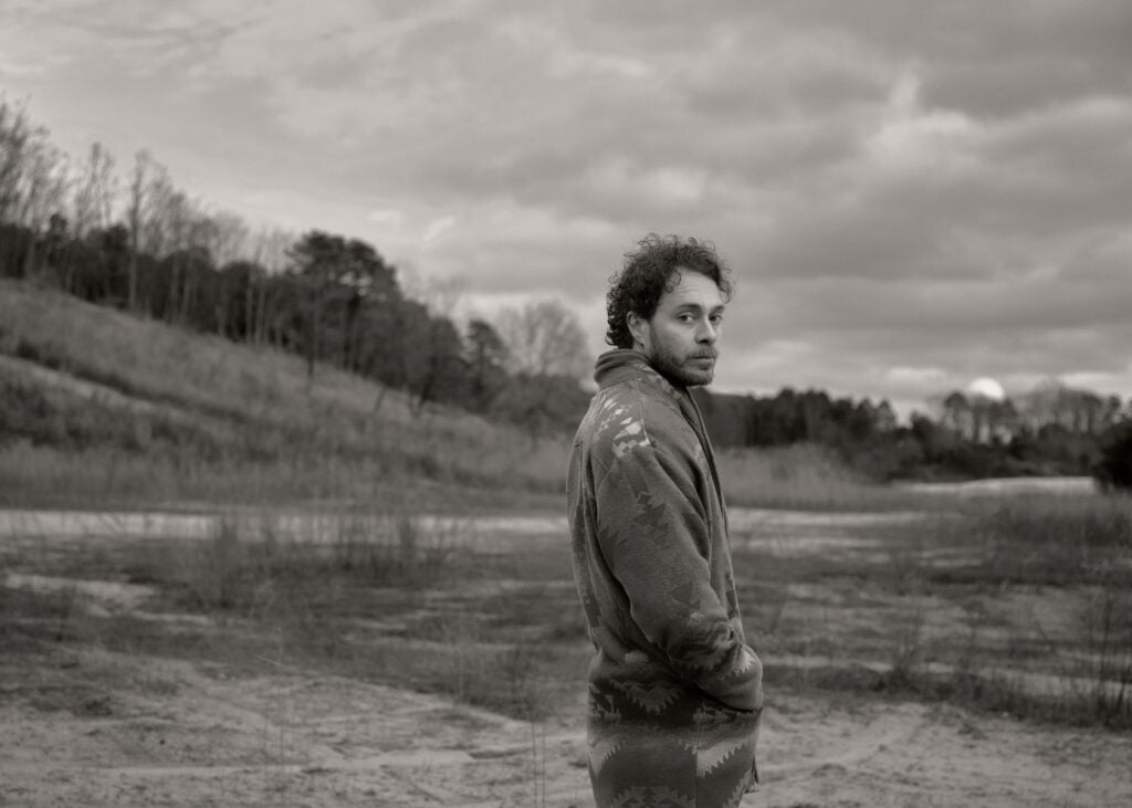 Amos Lee in a field