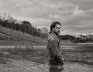 Amos Lee in a field