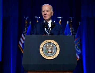Joe Biden speaking at a podium