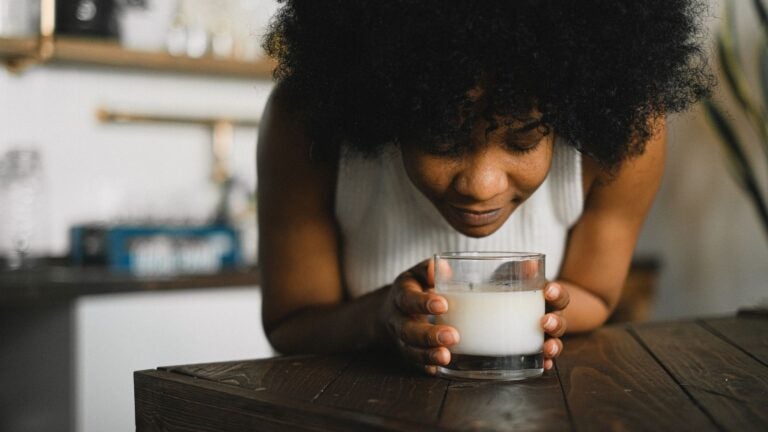 woman smells candle