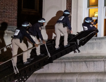 Using a tactical vehicle, New York City police enter an upper floor of Hamilton Hall on the Columbia University campus in New York, Tuesday, April 30, 2024, after the building was taken over by protesters earlier in the day.