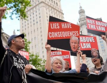 People react to the guilty verdict announced against former President Donald Trump outside Manhattan Criminal Court, Thursday, May 30, 2024, in New York.