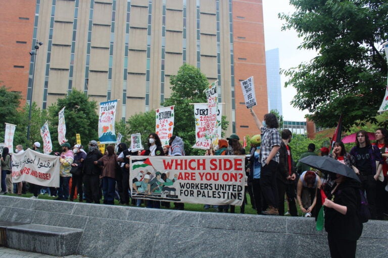 Hundreds of pro-Palestinian protesters marched from City Hall toward University City on Saturday. They linked arms and encircled a group of people setting up tents on Drexel University's campus. (Emily Neil/WHYY News)