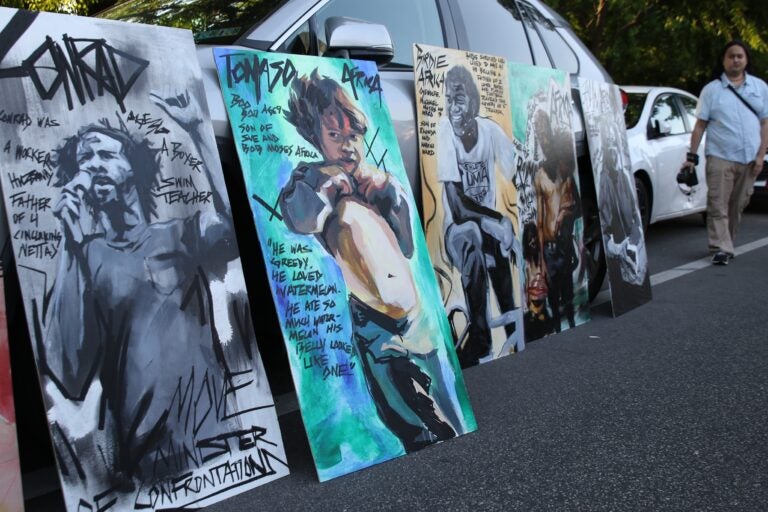 Paintings depicting victims of the MOVE bombing