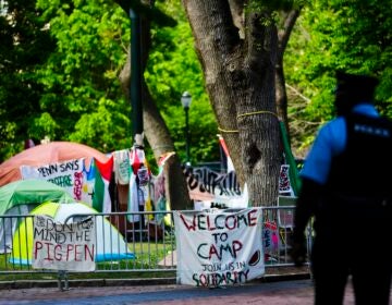 An officer stands outside a Gaza Solidarity Encampment at the University of Pennsylvania in Philadelphia, Wednesday, May 1, 2024.