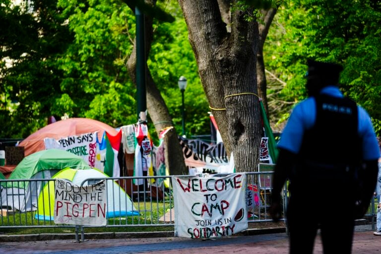 An officer stands outside a Gaza Solidarity Encampment at the University of Pennsylvania in Philadelphia, Wednesday, May 1, 2024.