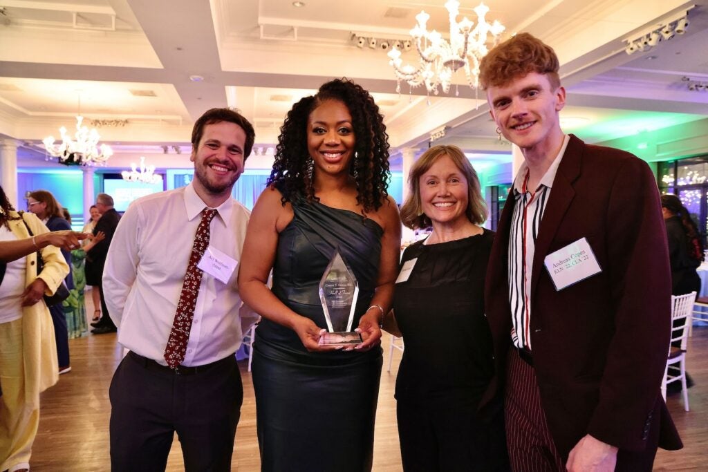 WHYY’s Cherri Gregg holds her award after being inducted into the Klein College Hall of Fame. She is surrounded by her ''Studio 2'' colleagues (from left) Avi Wolfman-Aren’t, Debbie Bilder and Andreas Copes.