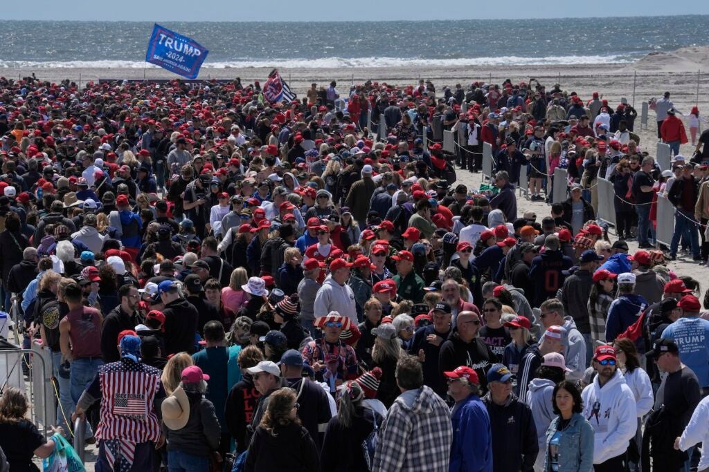 People wait in line to enter a campaign rally for Republican presidential candidate former President Donald Trump in Wildwood, N.J., Saturday, May 11, 2024. (