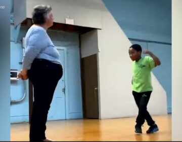a 2nd grader and a teacher dancing