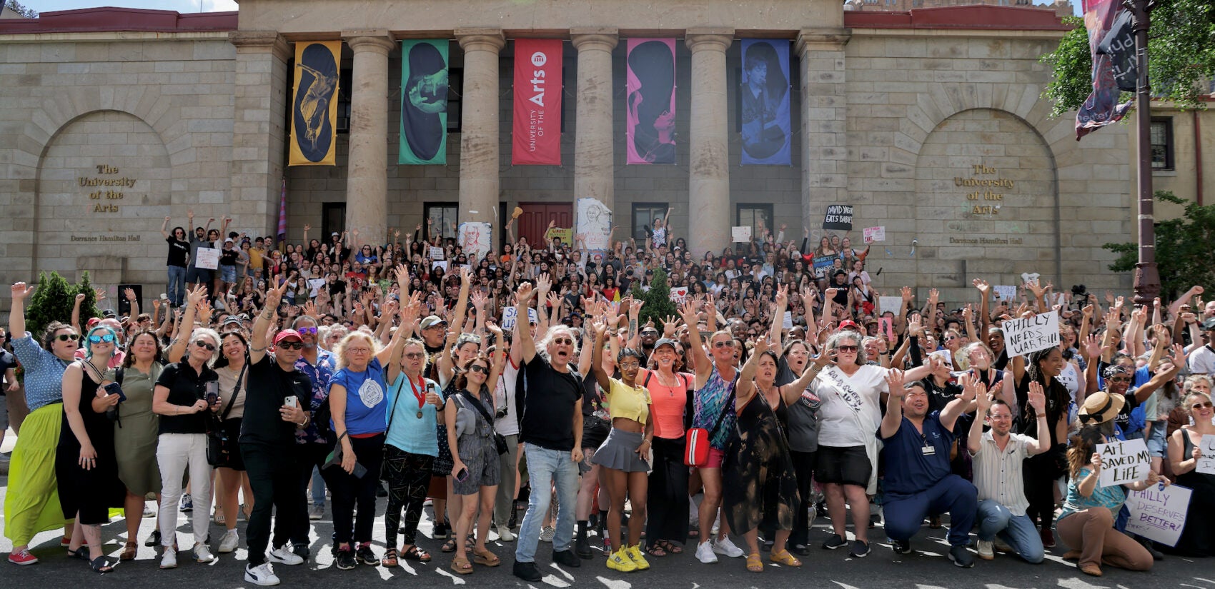 Students, faculty and staff gather in front of Hamilton Hall on South Broad Street for a group photo to mark the school's last day.