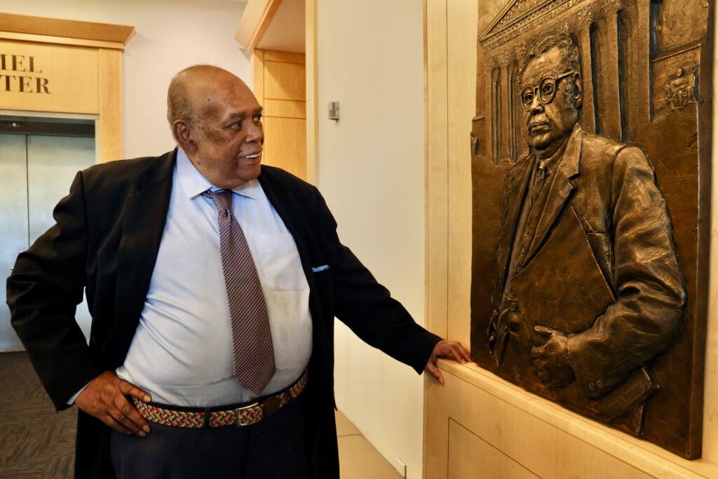 A bas-relief portrait of William Thaddeus Coleman Jr. hanging on the wall