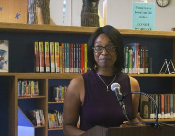 Community member Imani Davis, who sits on the Philly Joy Bank steering committee, called guaranteed income for pregnant people “life changing” during a press conference Sat., June 22 at Cecil B. Moore Library in Philadelphia. (Nicole Leonard/WHYY)