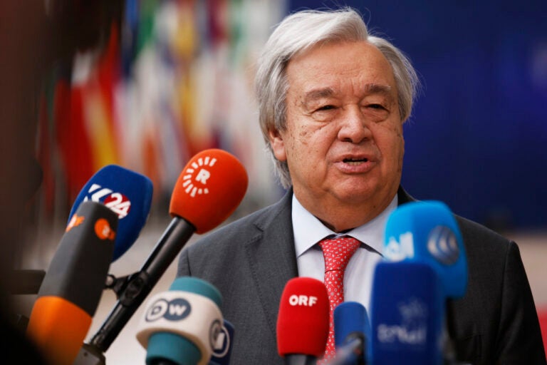 United Nations Secretary General António Guterres speaks into microphones