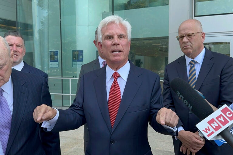 Influential Democratic power broker George Norcross, center, speaks outside the justice complex in Trenton, N.J., Monday, June 17, 2024, about being charged with racketeering and other charges in connection with government issued tax credits.