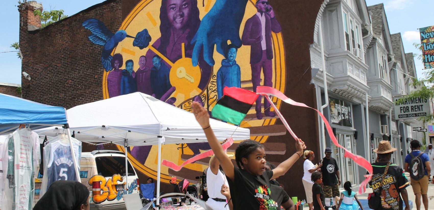 Thousands watched hundreds of people and floats make their way down 52nd Street on Sunday for Philadelphia's Juneteenth Parade and Festival. (Cory Sharber/WHYY)